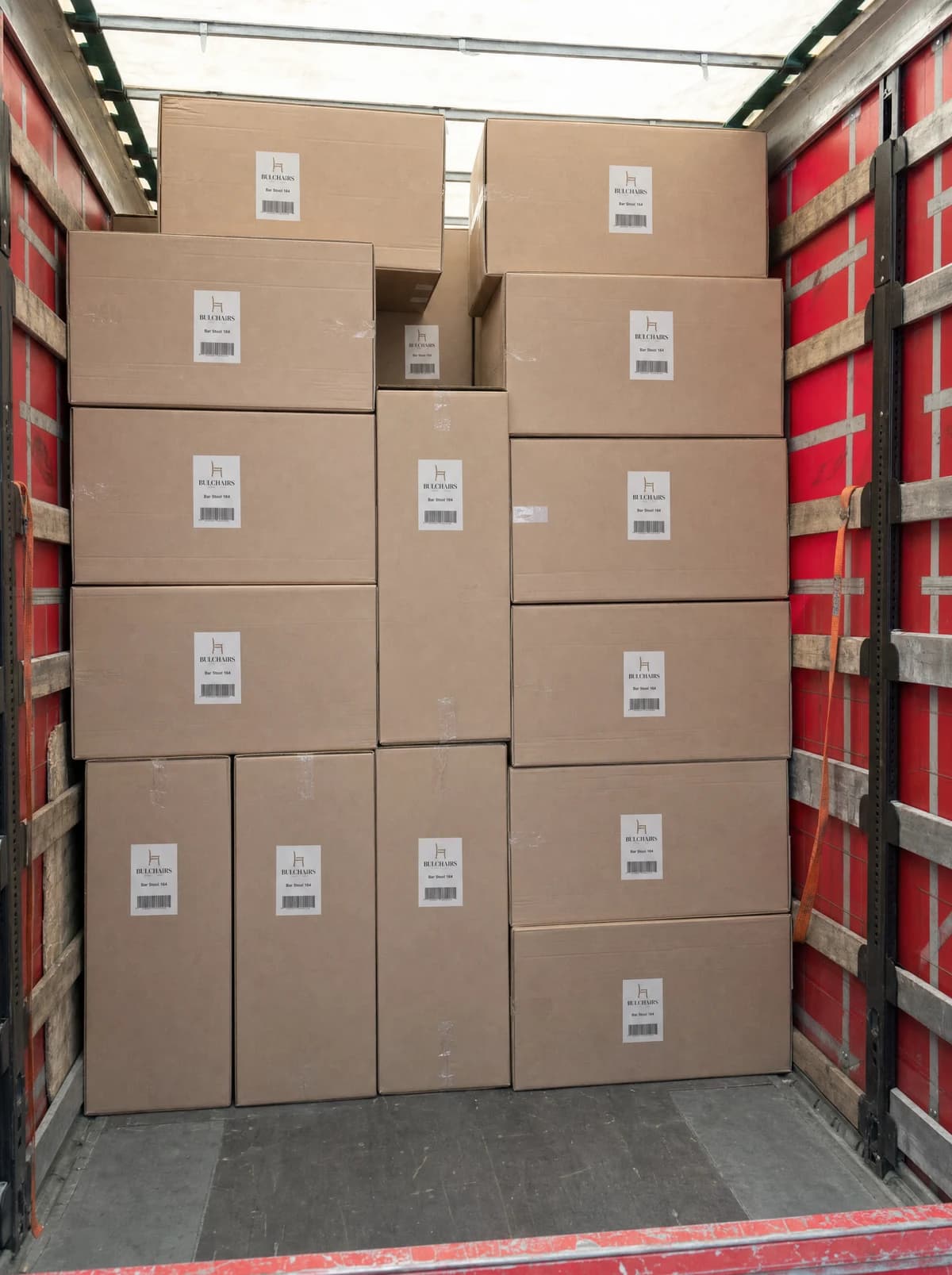 Labelled BulChairs cartons stacked to the roof inside a trailer